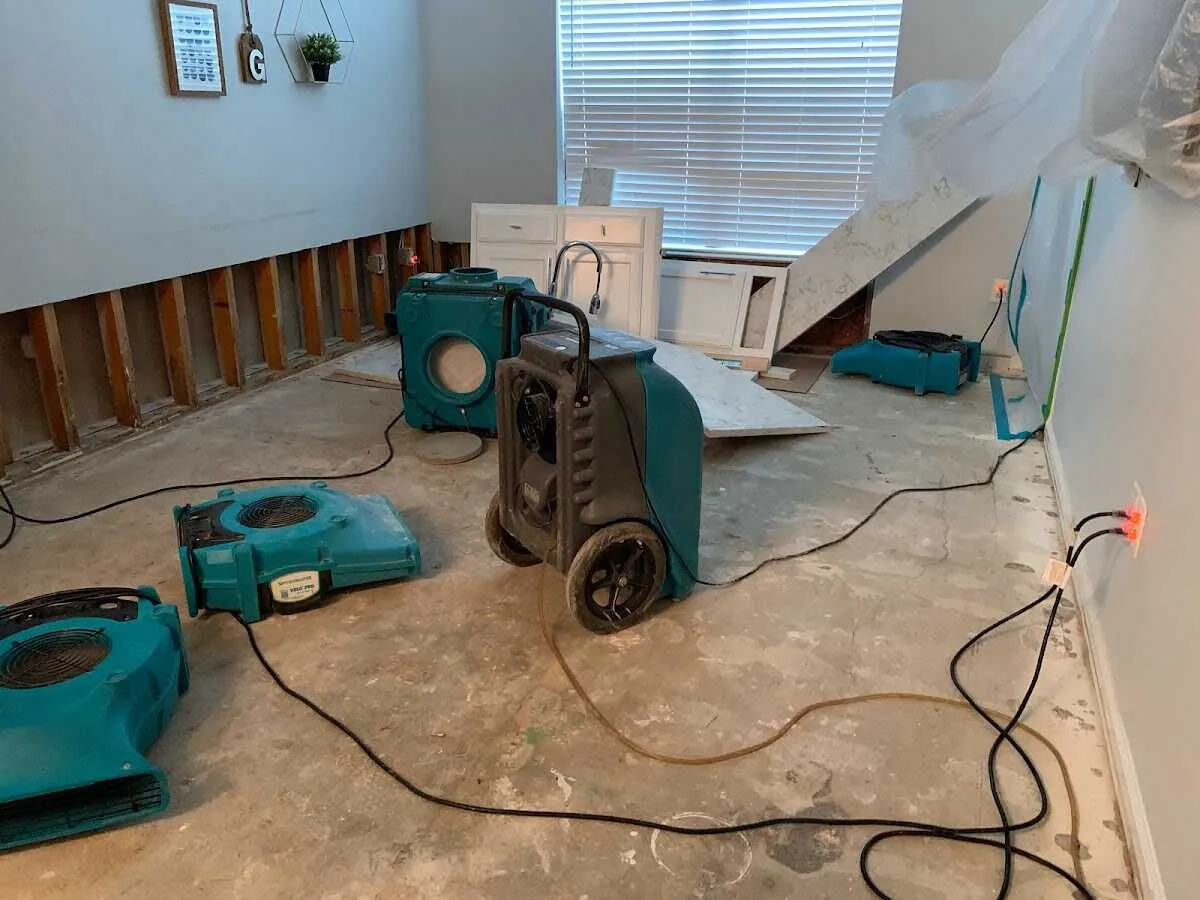 Dehumidifier in flood-cut room for Water Damage Restoration in Ellicott